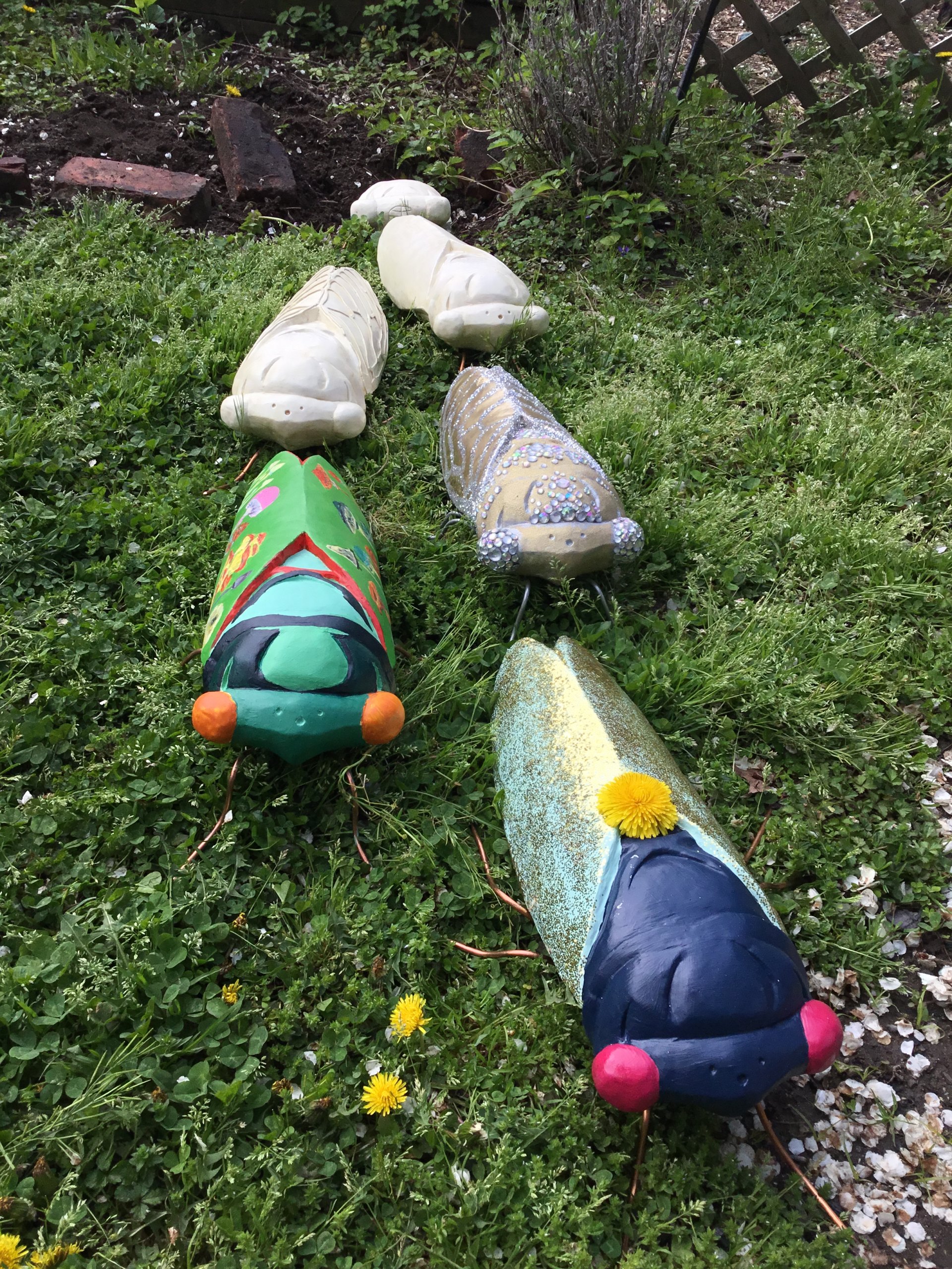 Cicada Parade-a's first bugs decoratded by family and friends to promote the project. IT WORKED!