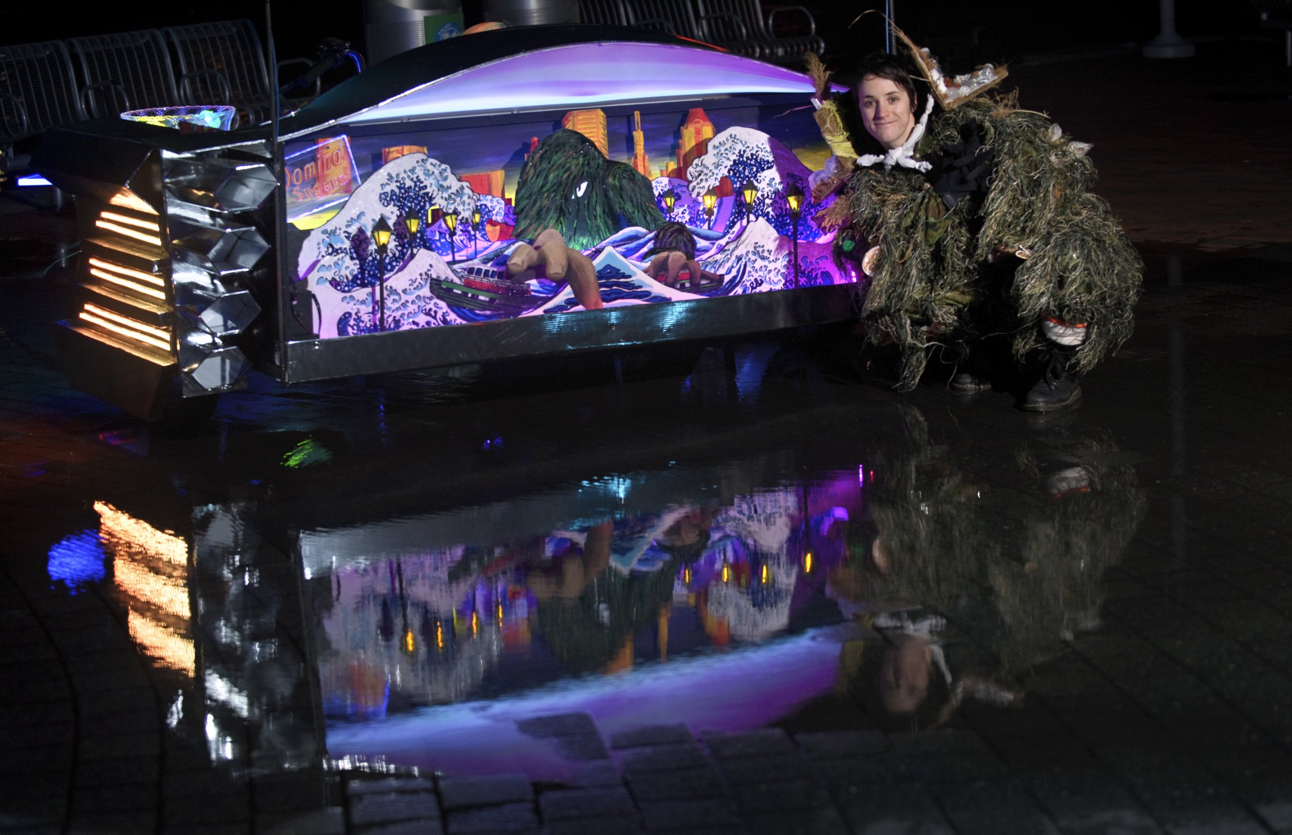 Katlyn Willie as the creature beside her 3D mural